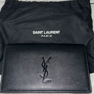 Black Yves Saint Laurent Clutch, pristine condition. Worn three times.
